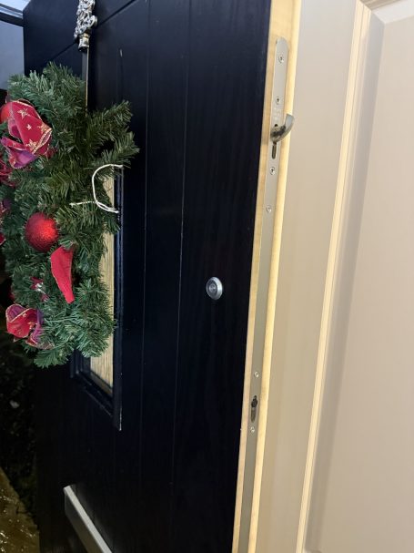 Multipoint Lock Replacement Replacement multipoint locking mechanism fitted to a black entrance door in Long Melford